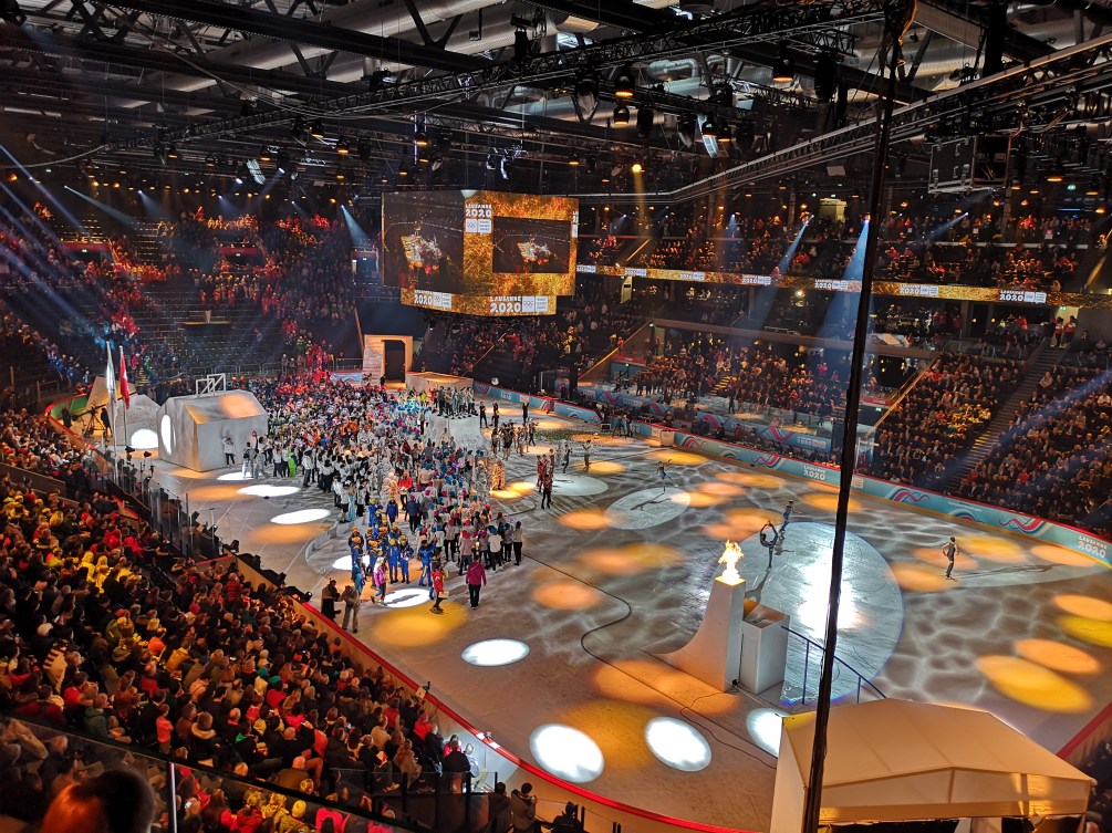 A large crowd gathers in an ice hockey arena for the 2020 Youth Olympic Games in Lausanne, Switzerland.