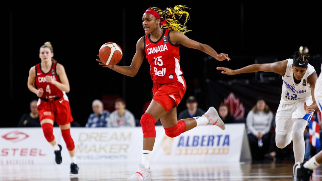 Basketball player dribbling on court
