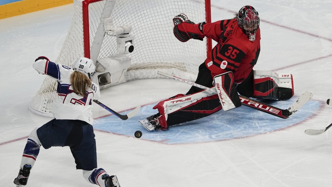 Ann Renee Desbiens sticks her pad out to make a save