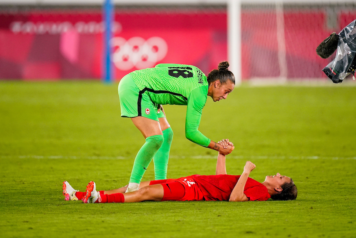 Christine Sinclair and Kailen Sheridan celebrate their win at Tokyo 2020